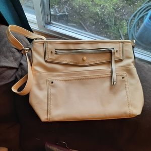 Straw colored shoulder bag.